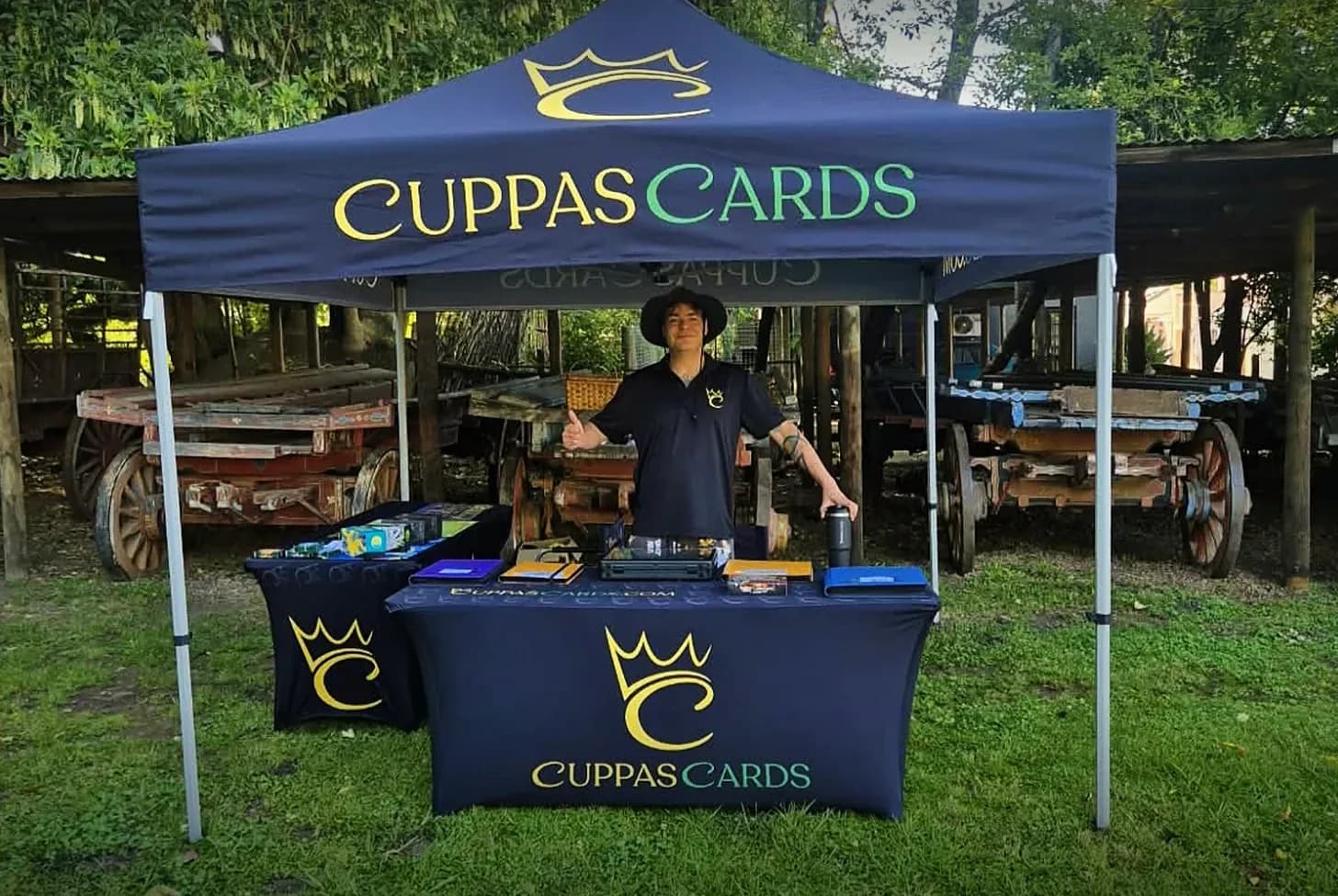 The CuppasCards grading booth at an event: a branded gazebo and tables